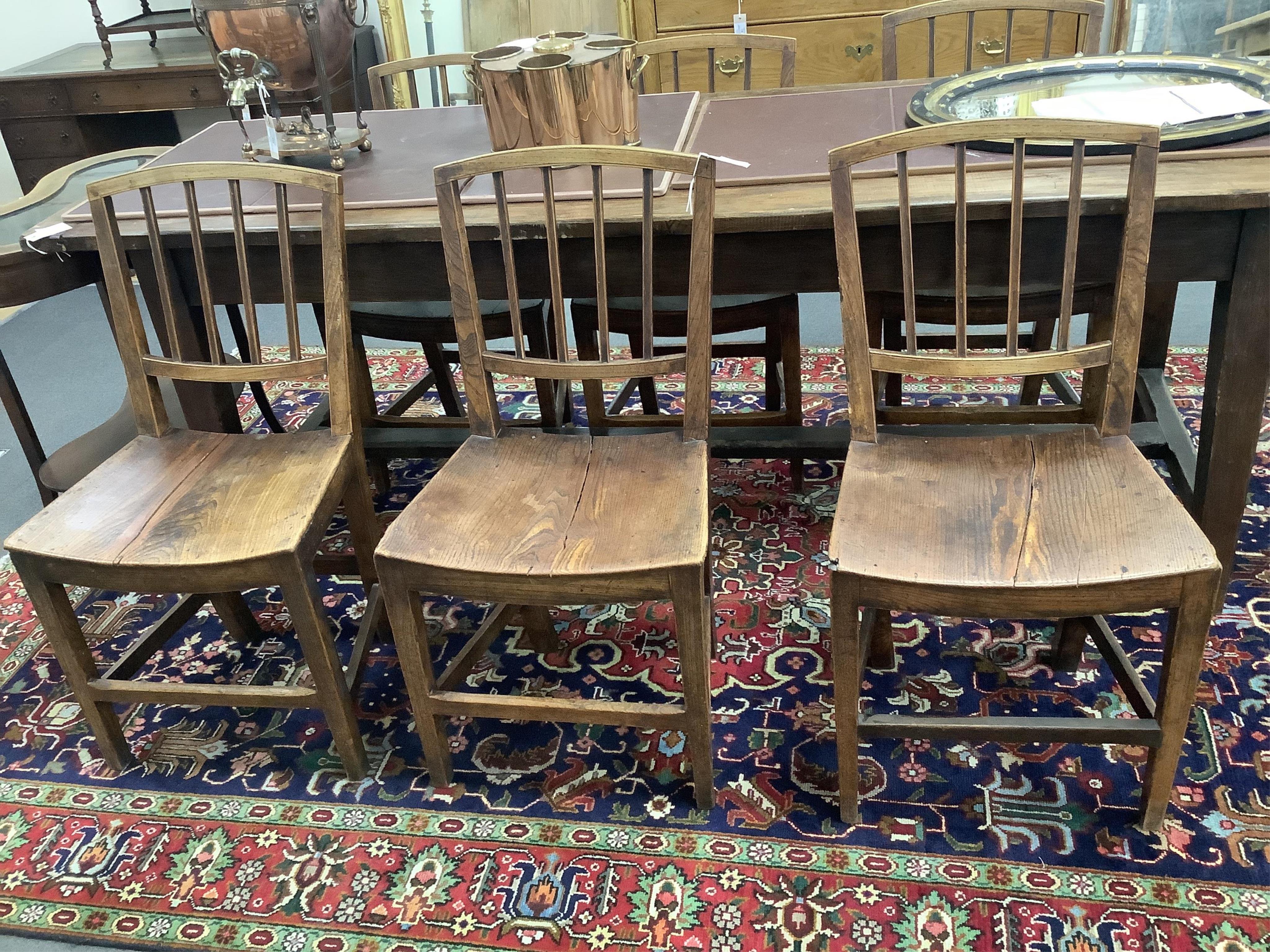 A set of six George III Provincial elm wood seat dining chairs. Condition - fair